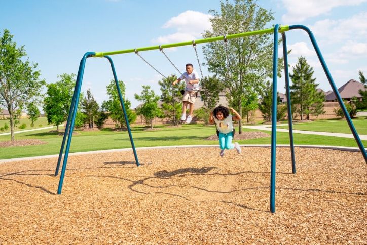 Kids on amenity playground in Elyson.