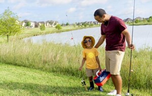 Father and son fishing at lake Elyson Katy, TX