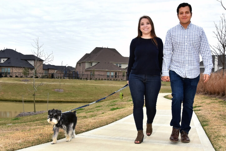 Elyson couple walking their dog