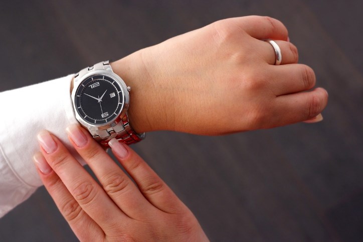 woman looking at her watch