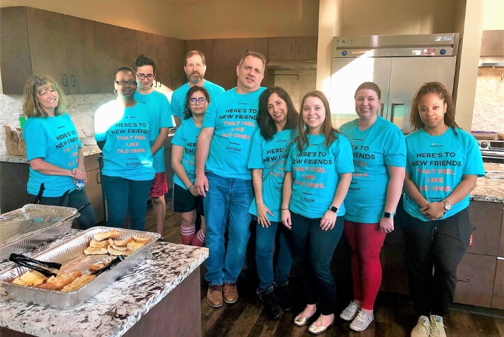 Elyson residents serving meals at the Ballard House