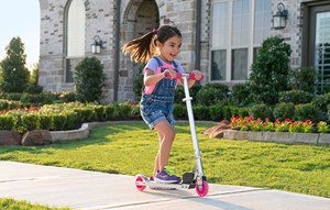Girl outside of new home in Katy, Texas at Elyson community