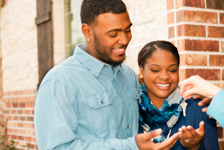 new homeowners receiving house keys