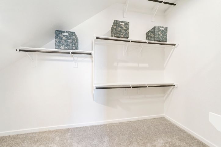 Chesmar Medina model home walk-in closet in Elyson