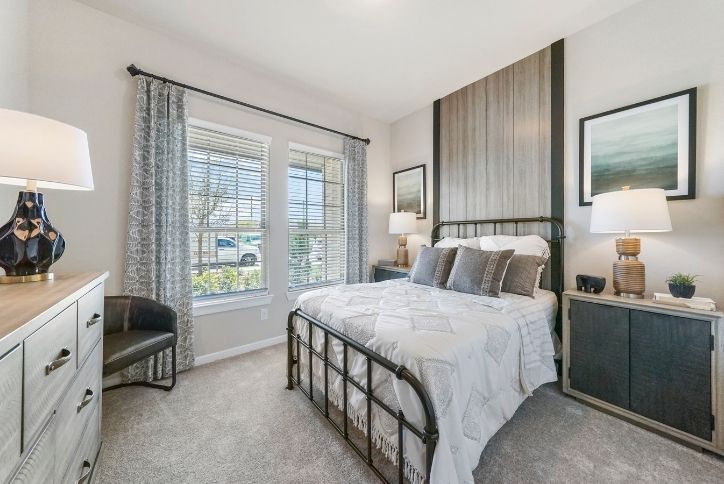 Chesmar Medina model home bedroom in Elyson