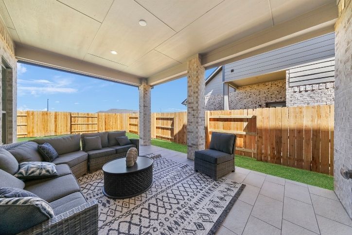 Outdoor living area of Chesmar model home in Elyson
