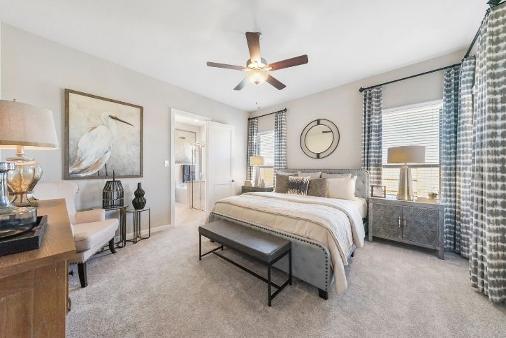 Chesmar Medina model home bedroom in Elyson