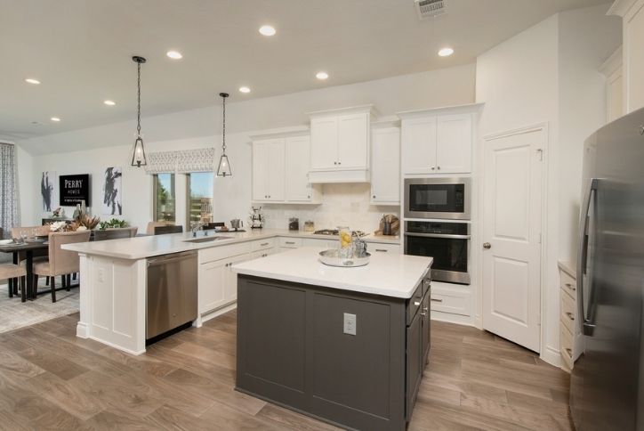 Open kitchen in Perry 1984 model home in Elyson