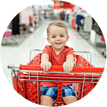 Boy in grocery cart. Elyson shopping.