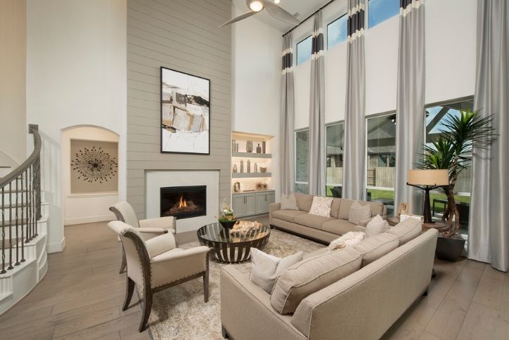 living room and wall of windows in Preston III model by Westin Homes