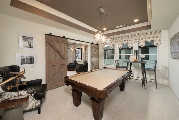 Gameroom with pool table in Westin Homes Preston III model