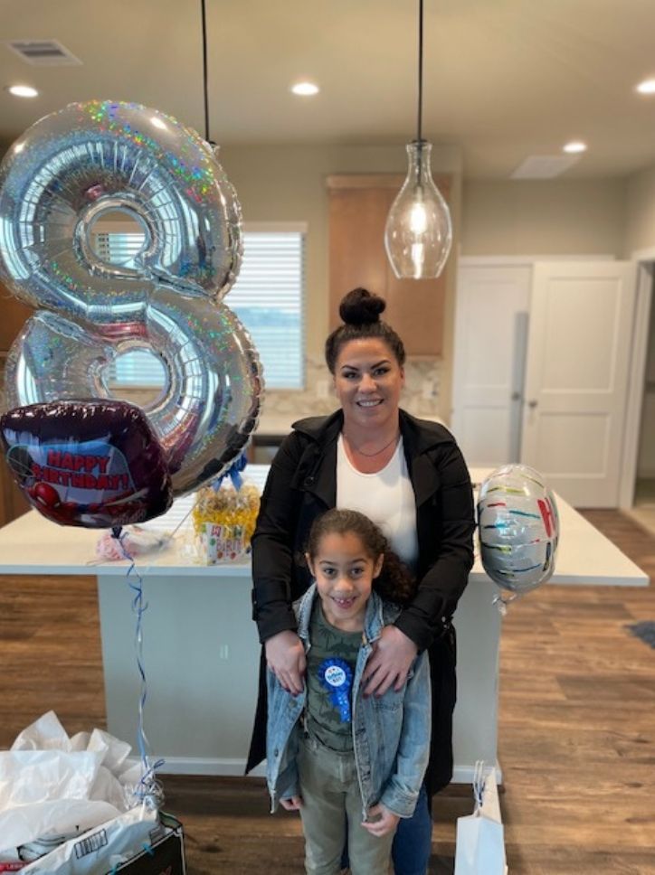 Torres family at their new home in Elyson