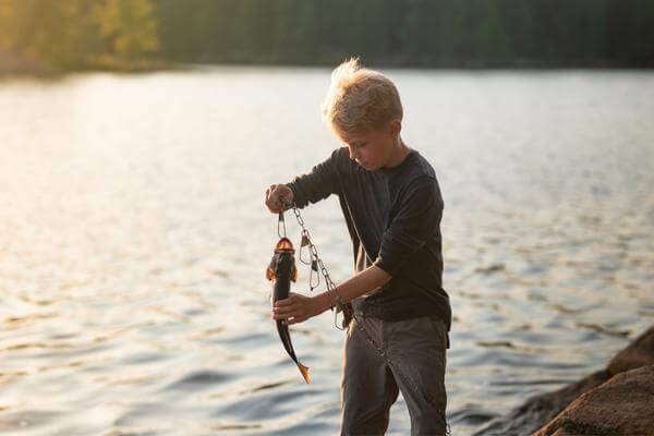 Little boy holding a fish on a hook Elyson Katy, TX