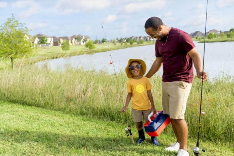 Father and son fishing at lake Elyson Katy, TX