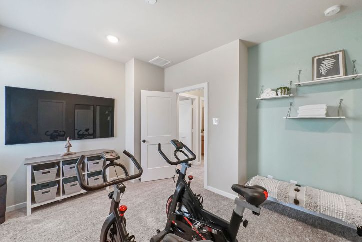The Riverdale Exercise Room by Chesmar Homes in Elyson community, Katy, Texas