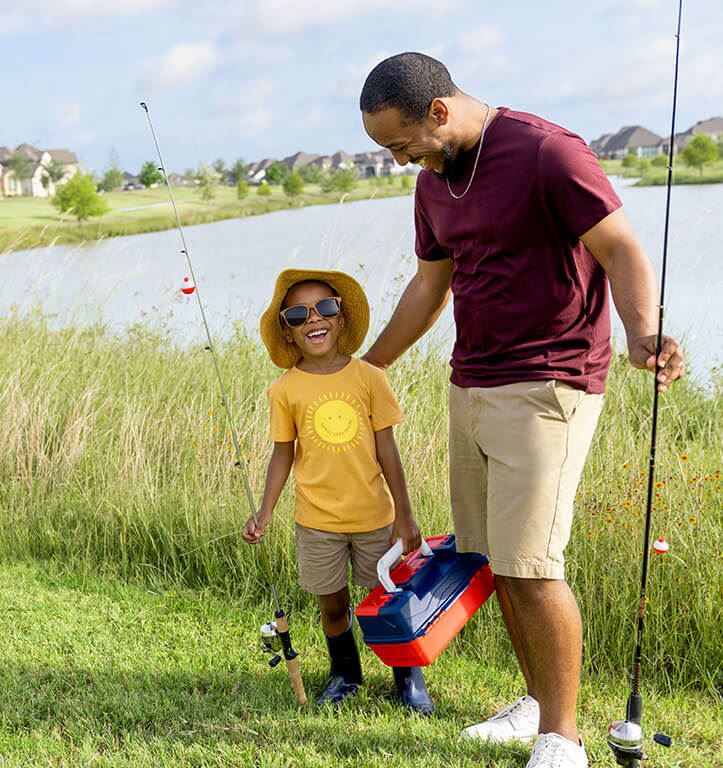 Residents enjoying pond in Elyson new home community Katy Texas