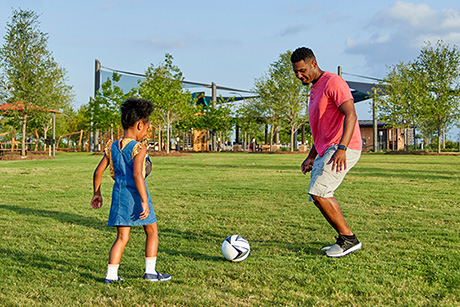 Father and daughter soccer Elyson Commons at Bear Creek