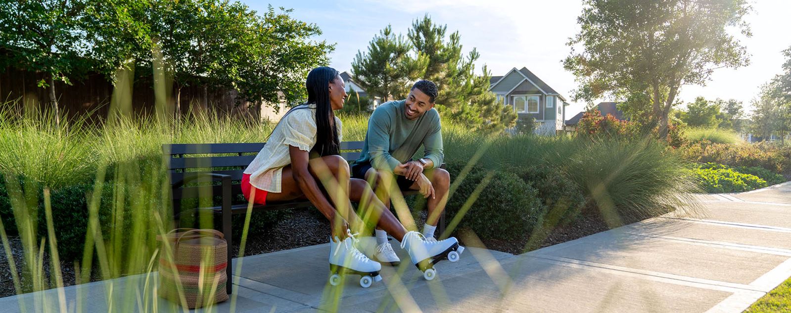 Man And Woman Sitting On A Park Bench 